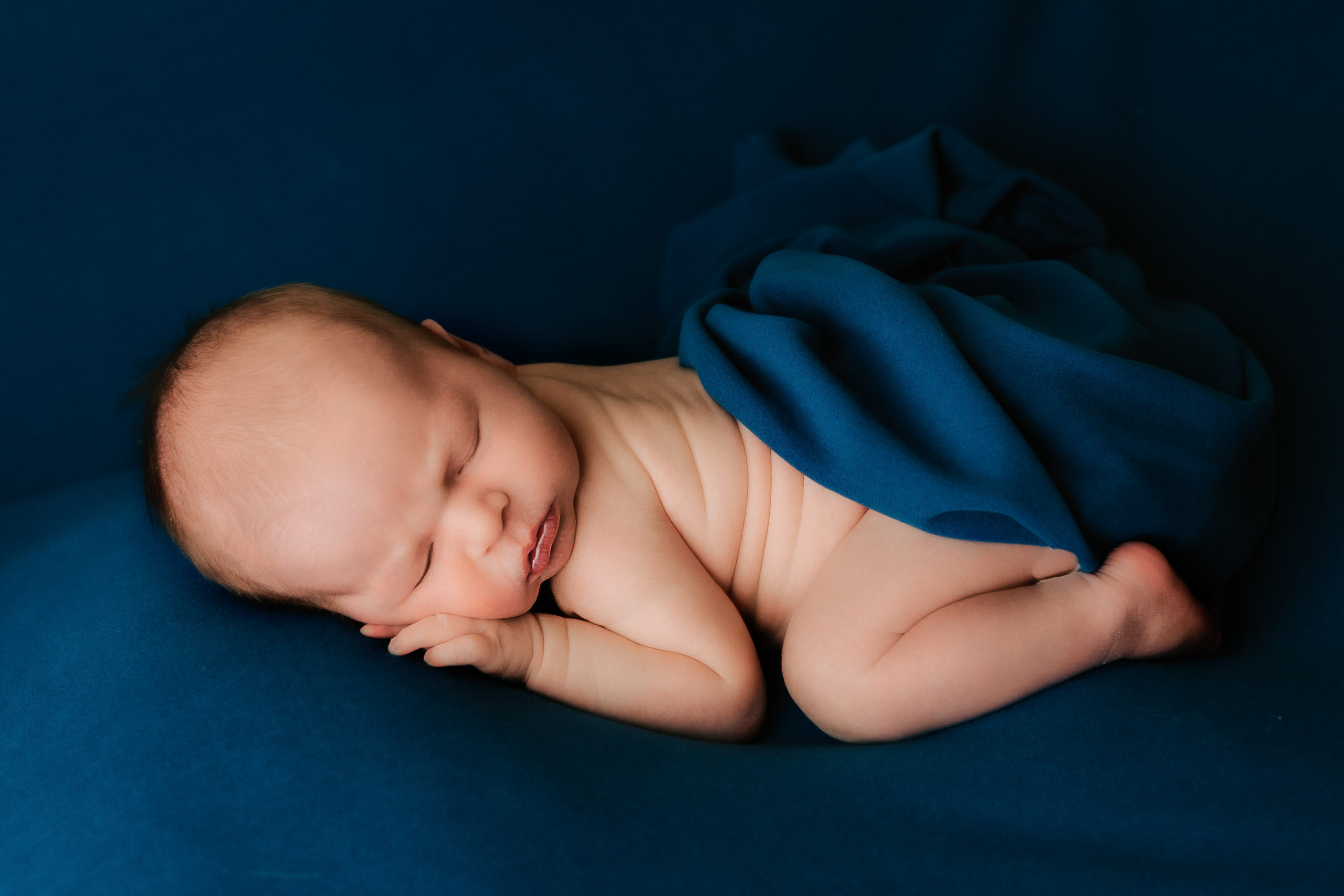 baby boy in bum up pose done by Milwaukee newborn photographer