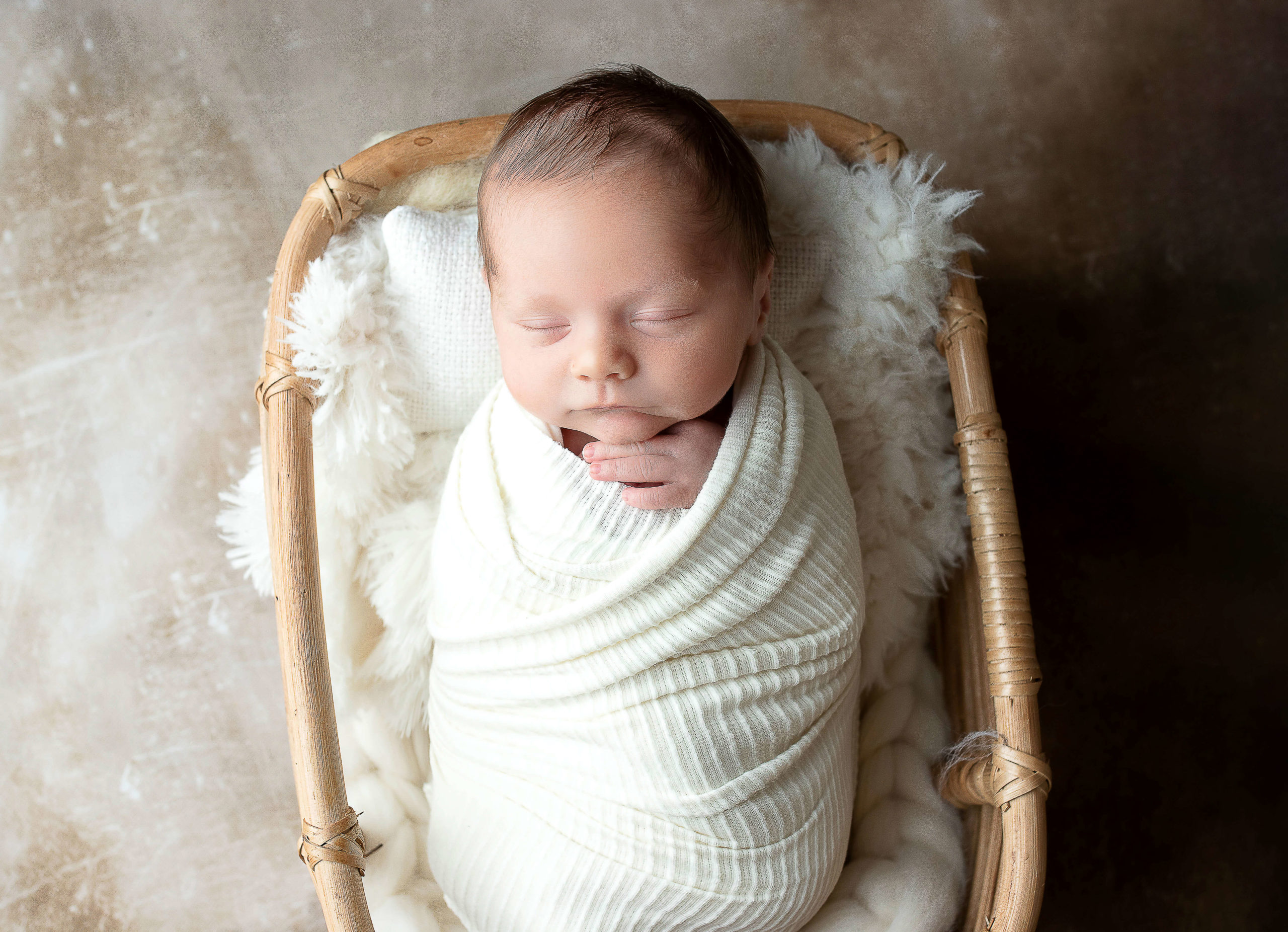 baby boy wrapped in cream blanket for Milwaukee newborn photography