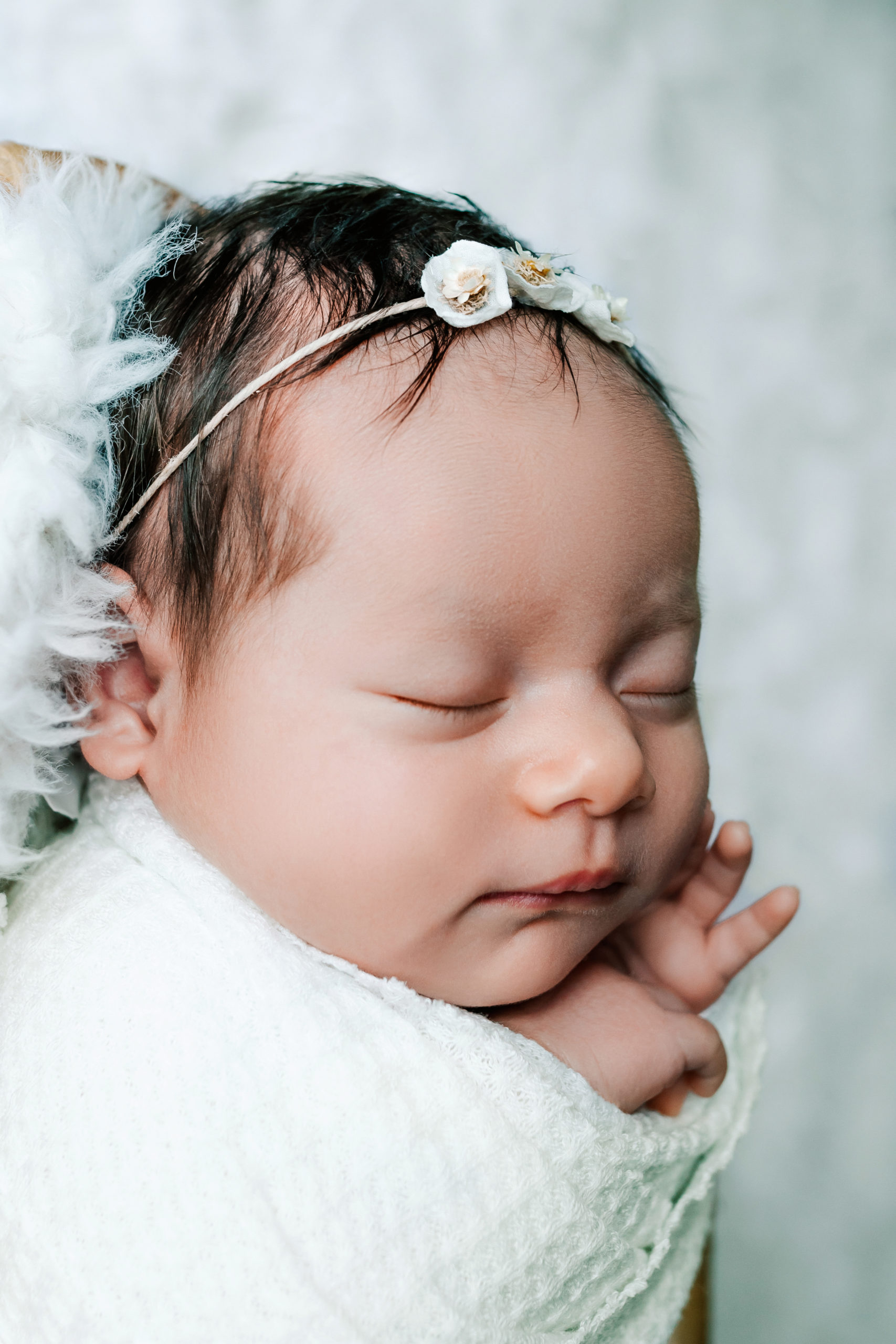 cream colored newborn wrap for a life style newborn session in lake country