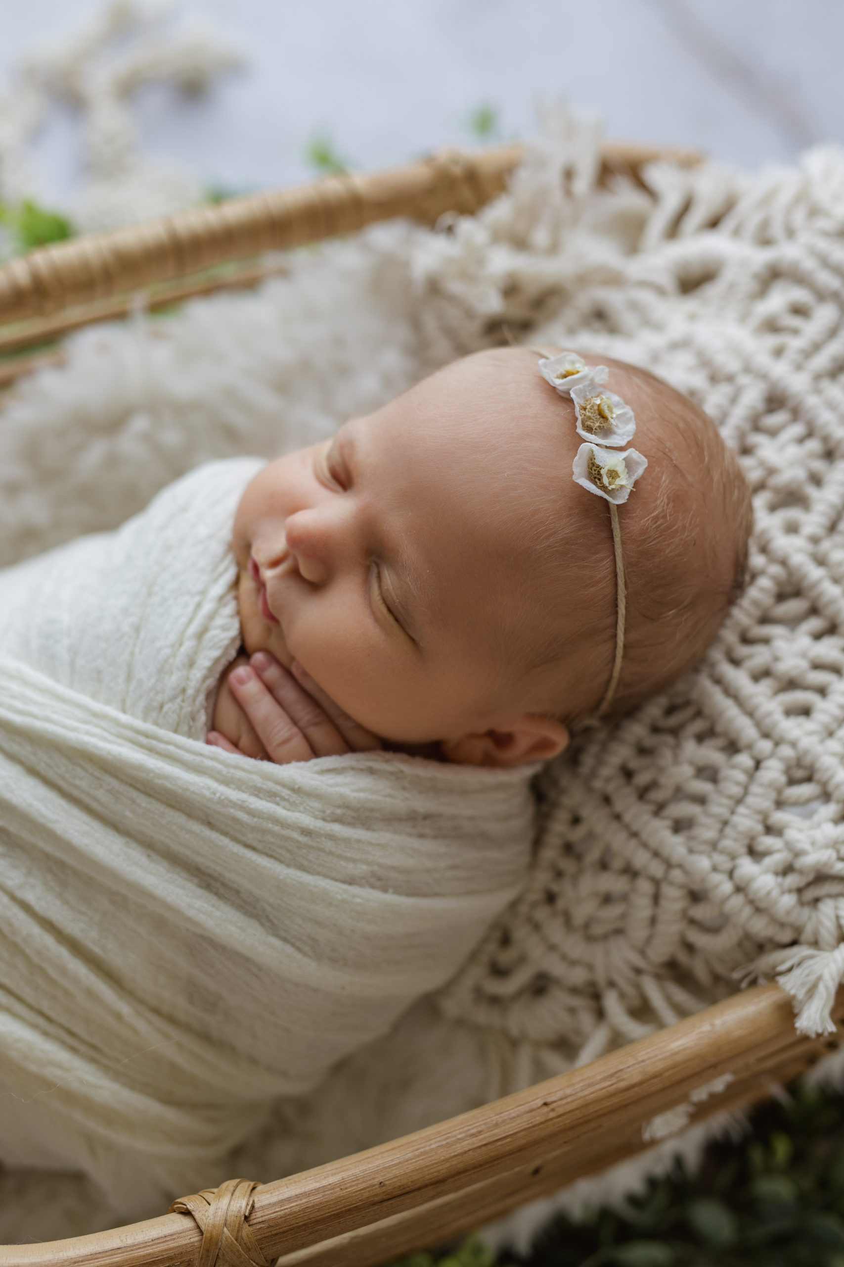 Brookfield newborn photographer capturing the details of new babies after they are born while baby is in a white wrap