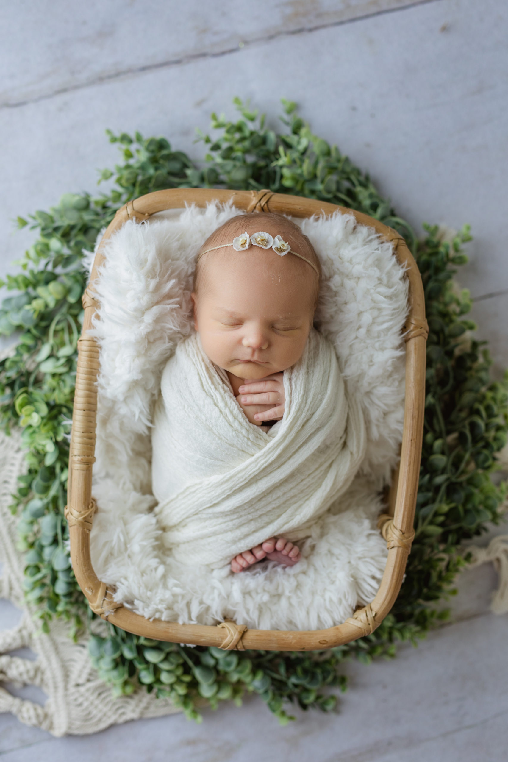 Waukesha newborn photographer took a photo of a baby girl in a boho set up