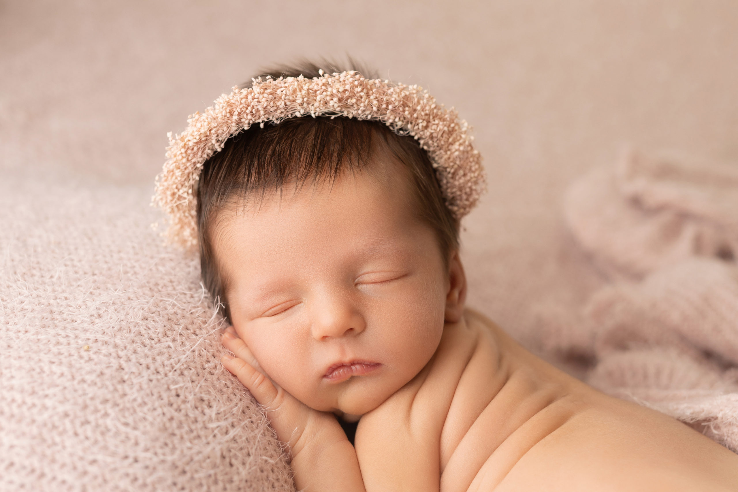 newborn baby girl sleeping with a flower crown Daycare in Wauwatosa